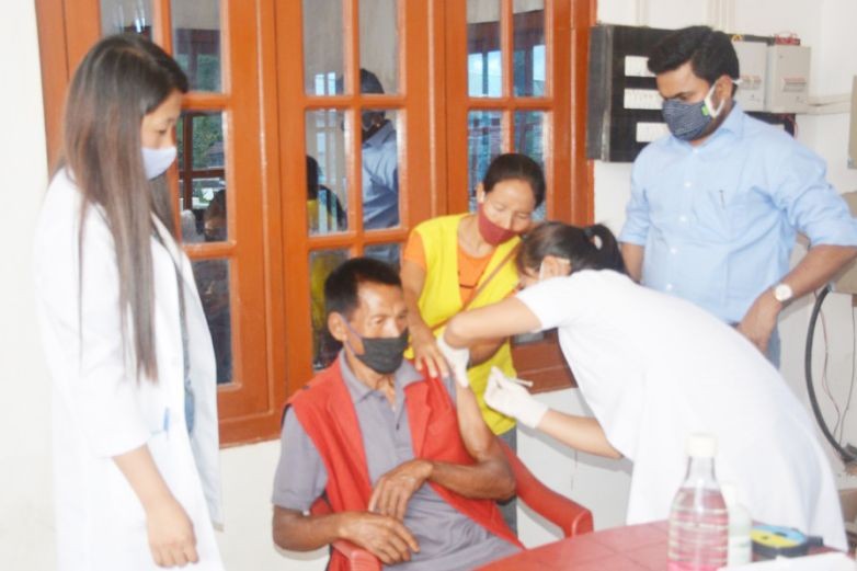 Medical team in the presence of by ADC, Tuensang, Ajit Kumar Verma, IAS administers vaccination to a beneficiary. (DIPR Photo)